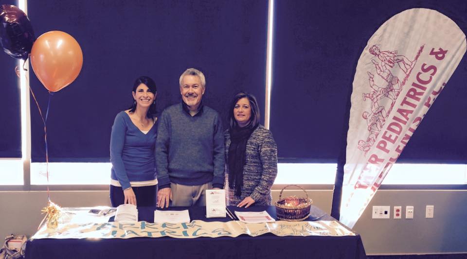 mentalhealth Multiple Parker Pediatrics doctors at a booth at the PACE Center.