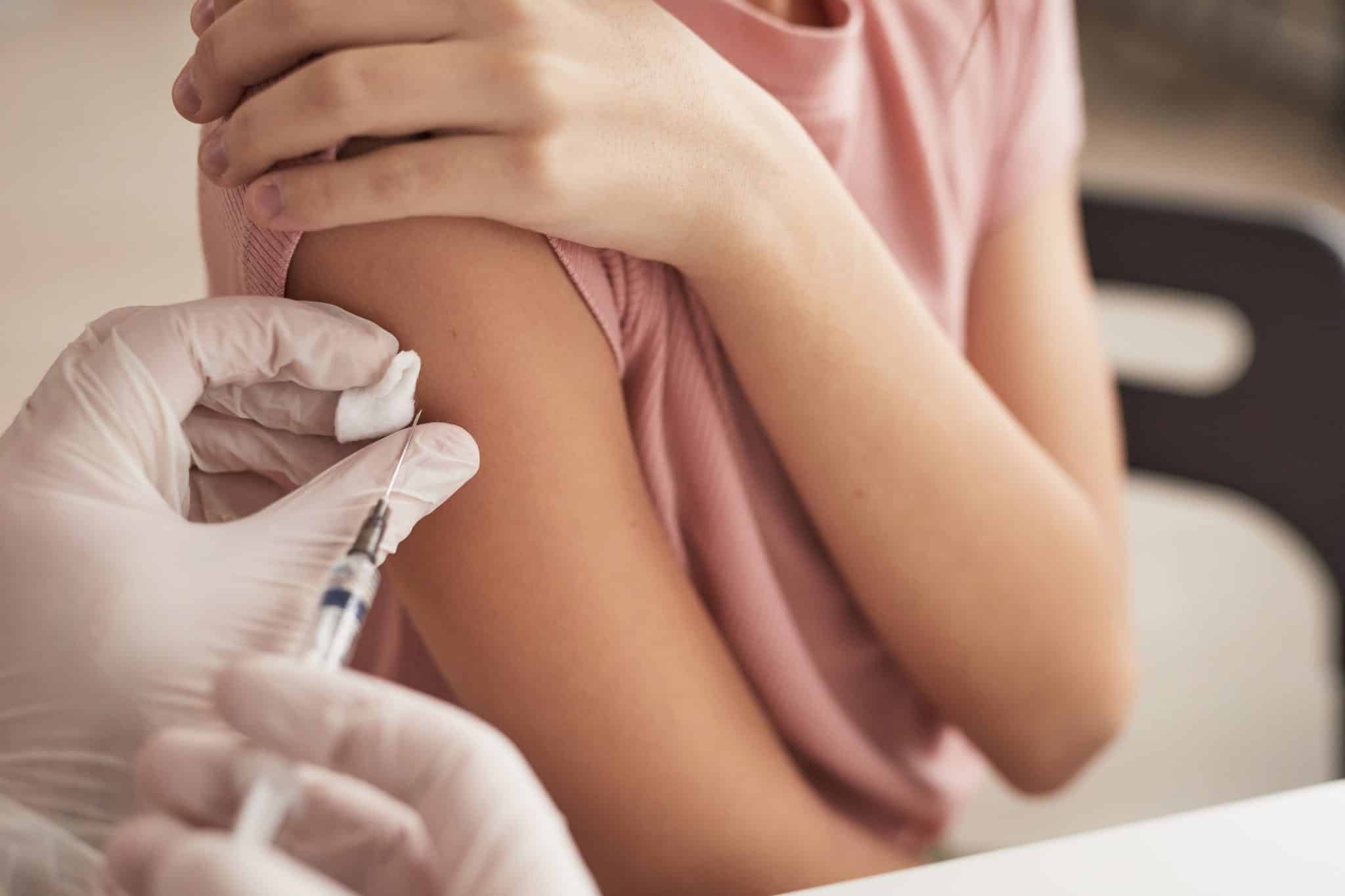 girl getting covid vaccine