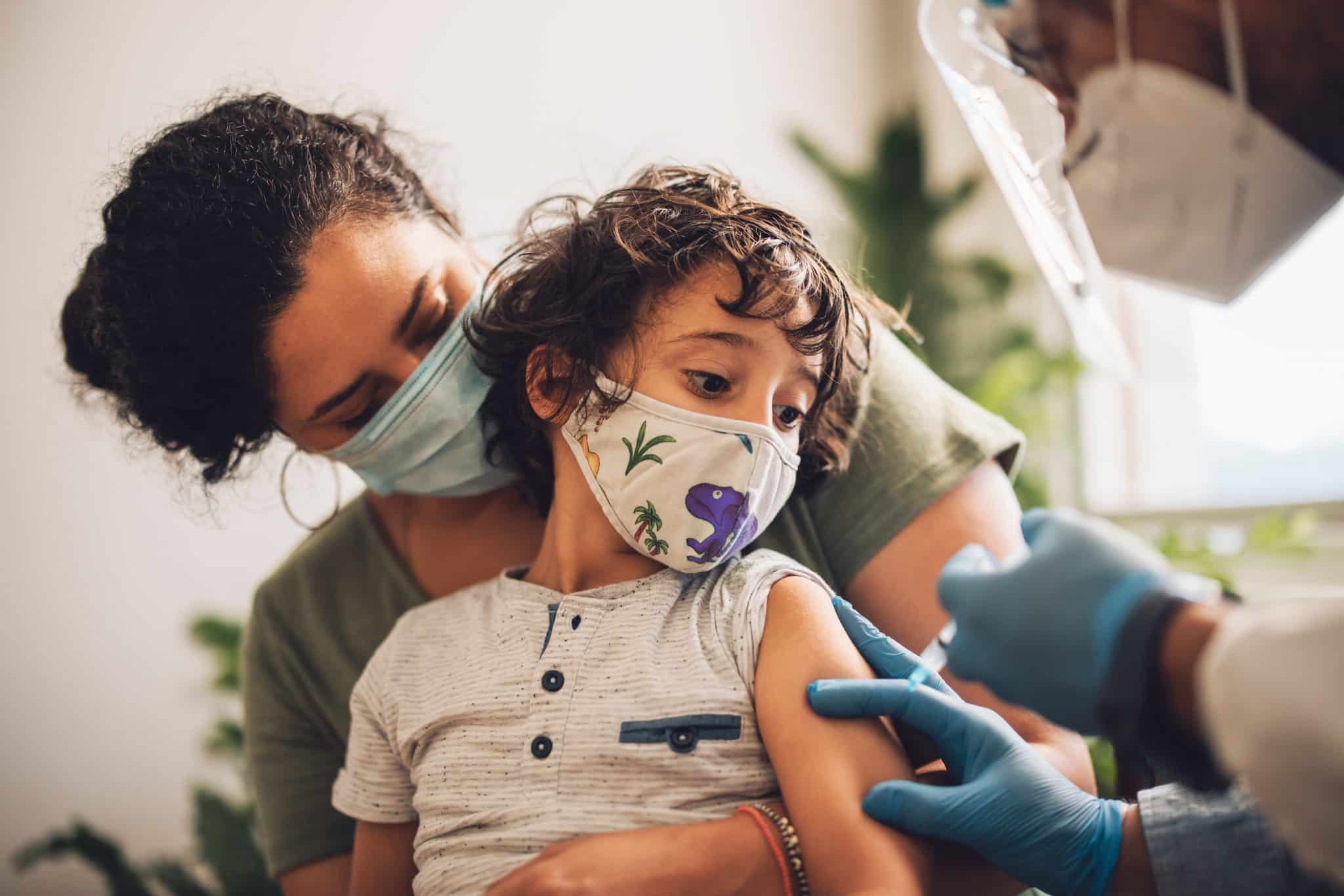 young boy getting pediatric flu shot