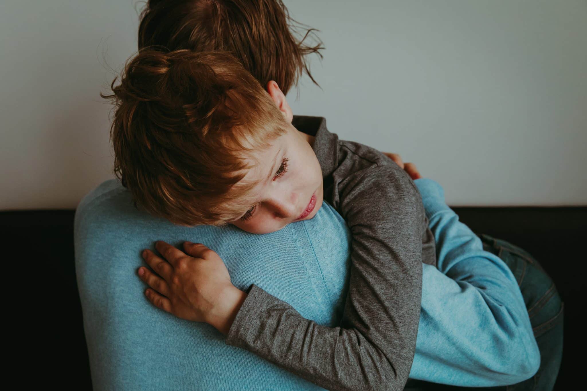 mother holding child who has pediatric anxiety symptoms