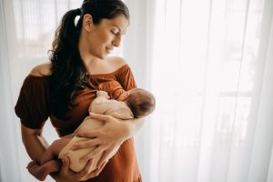 young mother breastfeeding her baby