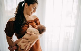 young mother breastfeeding her baby