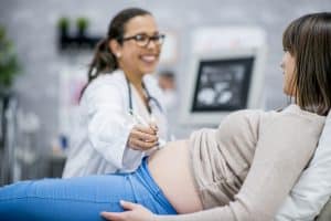 Woman getting an ultrasound at her prenatal appointment
