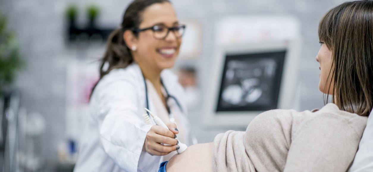 Woman getting an ultrasound at her prenatal appointment